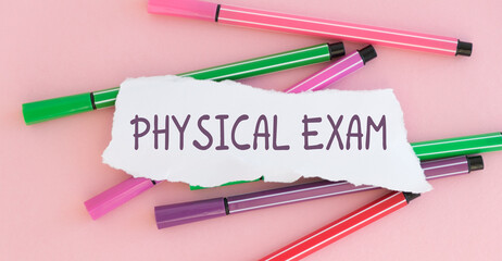 Sticker with Physical Exam text on notebooks on the pink background