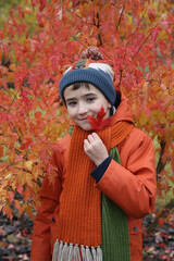 Fashion kid. Cute russian boy, fun child in Moscow city, Russia. Autumn stylish look for child, fashionable kid. Street style. Fashion kid outdoor. Child autumn sport outfit. Cool style for child