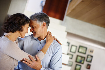 Trust, love and mature couple hug in house with care, support or soulmate connection while bonding. Happy, safety or people embrace at home for romance, security or sharing moment, dance or gratitude