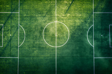 Top view,A soccer field, football field with a white line on the grass - obrazy, fototapety, plakaty