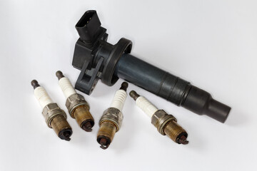Used ignition coil, spark plugs for petrol internal combustion engine - obrazy, fototapety, plakaty