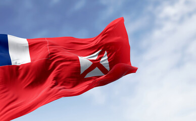 National flag of Wallis and Futuna waving on a clear day.