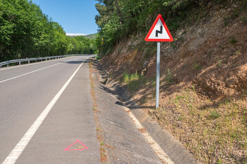 topography marking painted on a road, pink geodetic mark on the asphalt