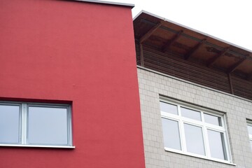office building with red walls and windows