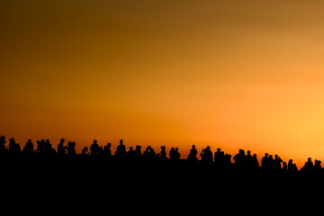 Florence, Italy - July 16, 2023: People waiting for the sunset on a bridge over Arno river in Florence, Italy - obrazy, fototapety, plakaty