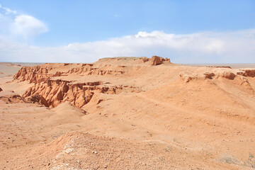 Fototapeta premium View on Bayanzag Flaming Cliffs on the Mongolian Gobi desert containing fossils of jurassic dinosaurs