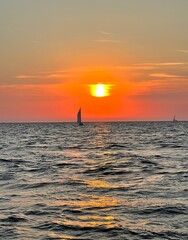 yacht in the sea at sunset