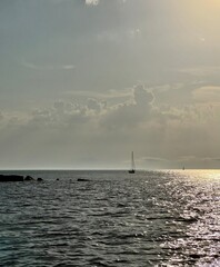 sailboat at sea at sunset
