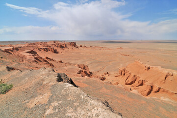 Fototapeta premium View on Bayanzag Flaming Cliffs on the Mongolian Gobi desert containing fossils of jurassic dinosaurs