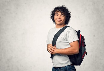 Portrait of a young happy student with backpack