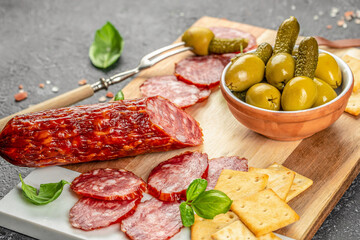 antipasti platter with assortment of salami, cheese and olives top view