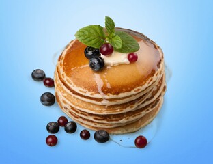 Tasty fresh pancakes with honey on plate