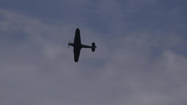 Old planes flying in the sky WW2 doing display and dogfight at airshow UK 4K England