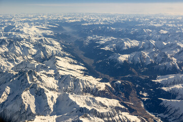 Aerial high altitude view of high peak mountains, Alps, in Switzerland's, Austria, France, Europe...