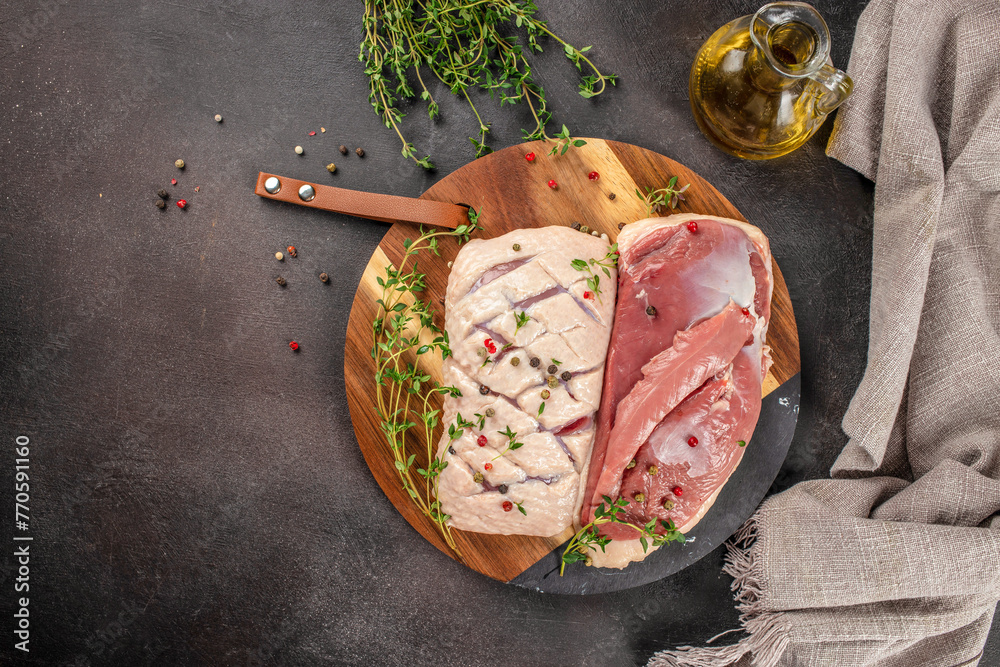 Canvas Prints raw duck breast fillet fresh meat on a dark background. top view. copy space for text