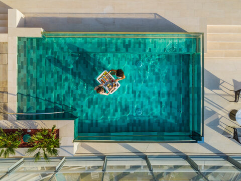 Aerial view of Palm Jumeirah with floating breakfast and rooftop infinity pool, Dubai, United Arab Emirates.