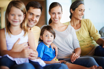 Obraz premium Big family, portrait and happy on sofa for love with bonding, care and affection for memories. Generations, together and relax in living room on couch for relationship growth with support for comfort