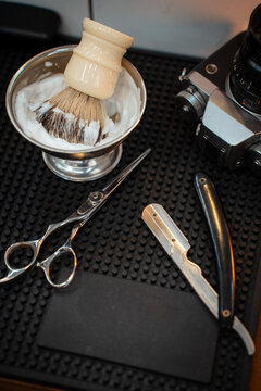 Scissors and shaving accessories and an old camera