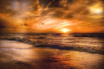 Papier Peint photo autocollant Séoul The sunset on the sea bathes the horizon in a radiant glow, as the sun descends, casting a fiery reflection upon the calm waters, creating a mesmerizing display of colors that captivates the soul and 