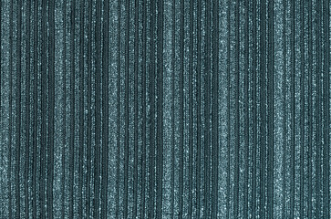 The texture of knitted fabric with lurex. A fragment of shiny striped fabric.