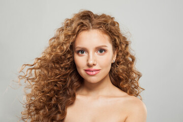 Gorgeous woman face. Young model with healthy skin, long hair and makeup on white background