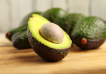 Fresh avocado on wooden background - 770602911