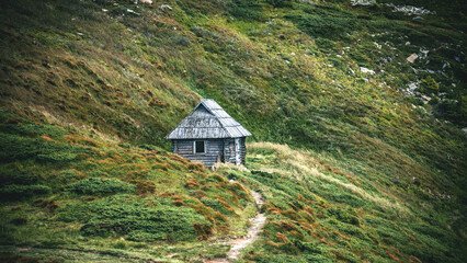 Lonely Wooden Hut in the Mountain Hills - 770618331