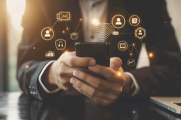 Businessman using mobile smart phone. Financial and banking icons around phone, concept.