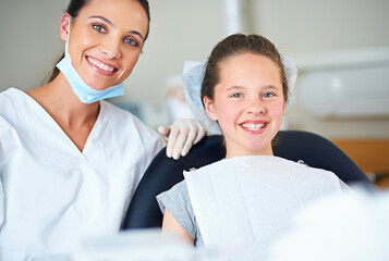 Portrait of dentist and child for consulting, dental service and teeth whitening for wellness in clinic. Healthcare, dentistry and happy woman and girl hygiene, oral care and medical consultation