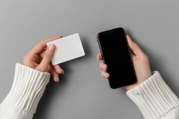 Woman holding credit card mockup and phone. Generative AI