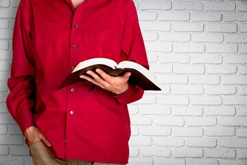 Young woman pray at dark church