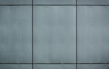 siding on the wall of a building as a background metal background