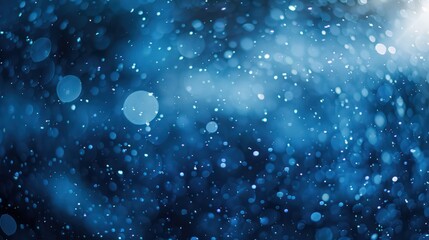 Snowfall in winter, blue light, blurred background