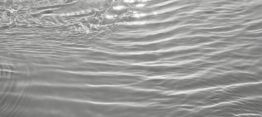 Closeup of desaturated transparent clear calm water surface texture with splashes and bubble. Generative AI.