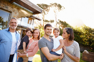 Big family, happy and portrait in backyard for love or bonding, care and memories together. Generations, garden and relax in summer for relationship growth or connection with unity on vacation