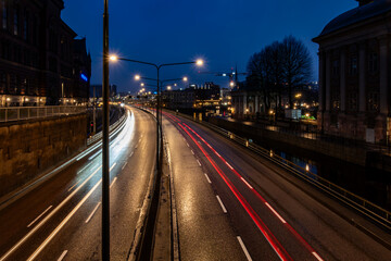 Fototapeta na wymiar Stockholm, Sweden A night view of traffic on the Centralbron Bridge in downtown.