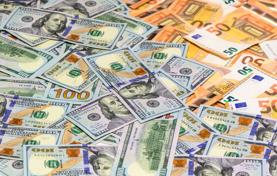 Banknotes of 100 dollars and 50 euros as a background close-up