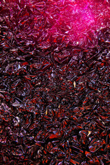 Background of crumpled shiny dark red foil