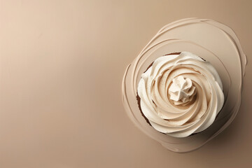 Top view of chocolate cream cake on beige background. Minimal concept. Creative copy space.