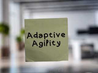 Post note on glass with 'Adaptive Agility'.