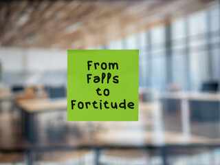 Post note on glass with 'From Falls to Fortitude'.