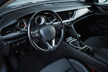 Stylish, spacious family car. Modern car interior, black perforated leather, aluminum, details...