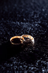 Engagement rings on black background