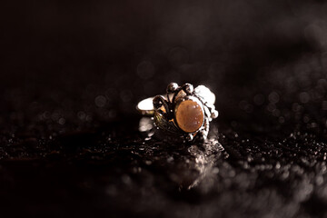 Ring with a stone on a black background
