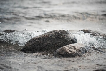 Beautiful view of rocks and splashing waves on the shore - Powered by Adobe