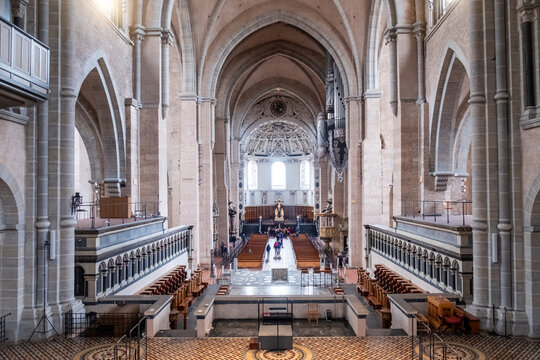 Trier, Rijnland-Palts, Germany, 23th of March, 2024, This photograph showcases the impressive interior of Trier Cathedral or dom, highlighting its Romanesque architecture. The spacious nave is bathed