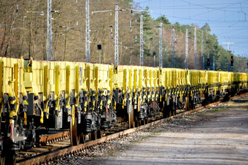 endless row of yellow cargo wagons