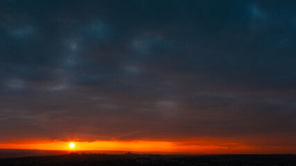 Fototapeta na wymiar Colourful landscape of beautiful dark sunset or sunrise close to evening.