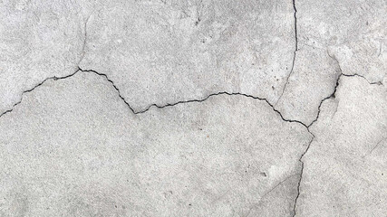 Crack wall texture. Cracked concrete wall covered with cement surface as background. Wall fragment...