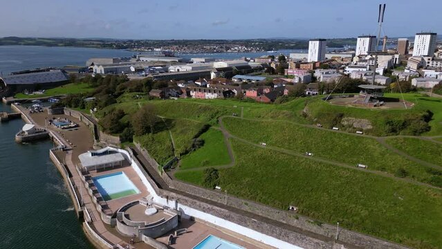 Drone footage of Mount Wise Observation Tower and Mount Wise Pools on a sunny day in Plymouth, UK